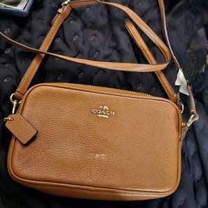 Coach NY clutch purse with strap new,but no tags.